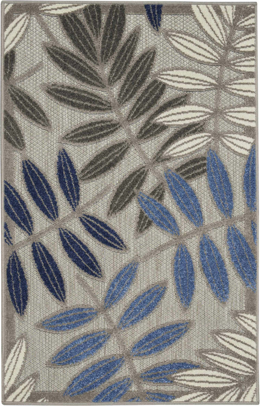 Close-up of the Nourison Aloha Grey Blue Tropical Area Rug featuring a leaf pattern in blue, gray, and white.