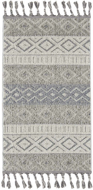 Close-up of the Nourison Paxton Ivory/Slate rug. Scandinavian style with diamond pattern and tassels. Gray and ivory hues.