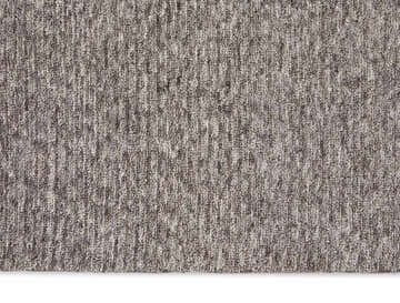 Close-up of the plush texture and subtle gray color variations in the Calvin Klein Tulsa Grey Area Rug.