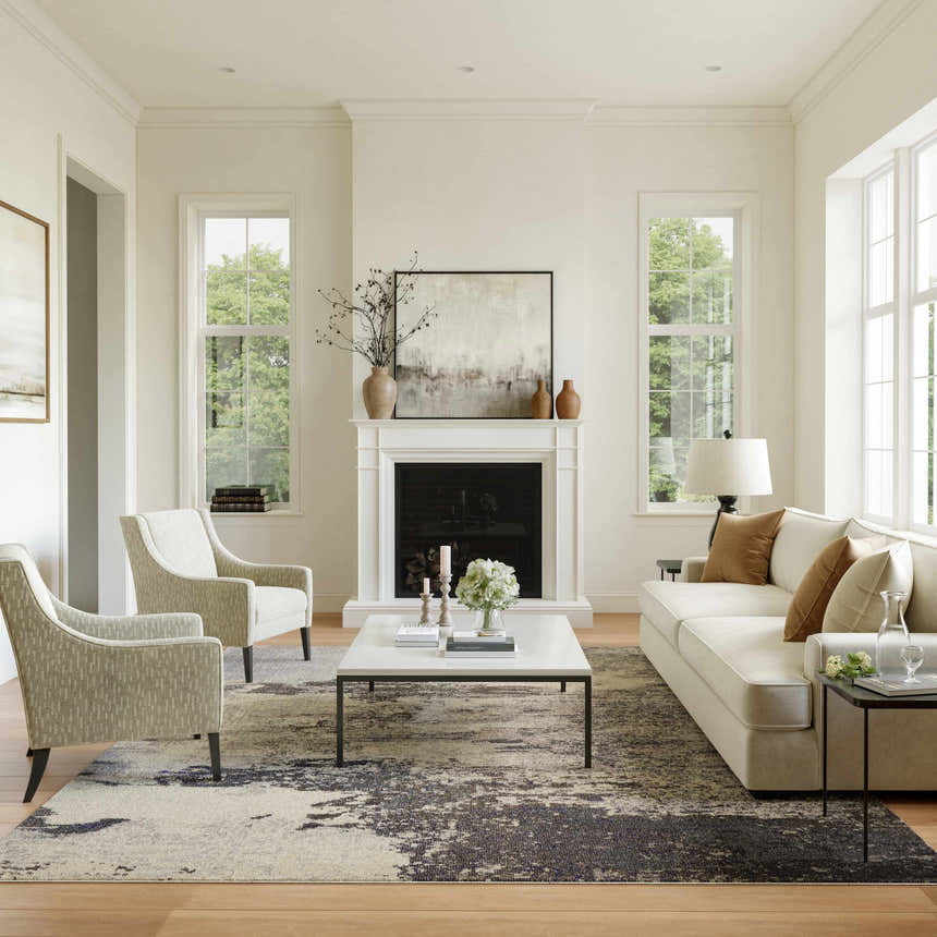 Living room scene with a Nourison Celestial Ivory Grey rug, fireplace, sofa, and chairs.