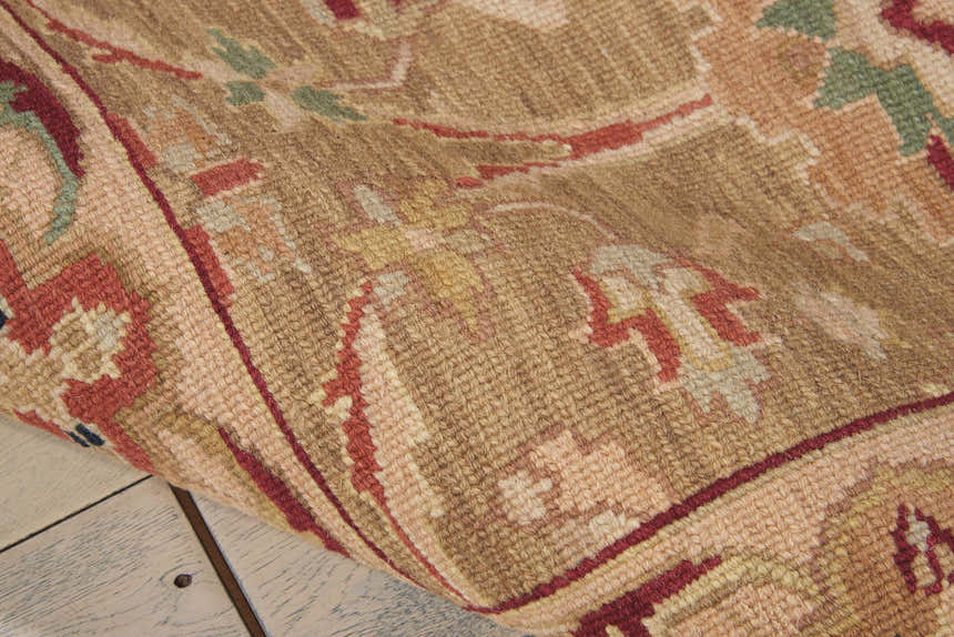 Close-up of the handmade Nourison Nourmak Olive Vintage Area Rug showing wool texture and traditional pattern.