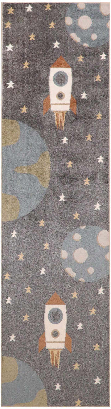 Close-up of the Nourison Astra Sky Blue Kids Rug featuring rockets, planets, and stars on a gray background.