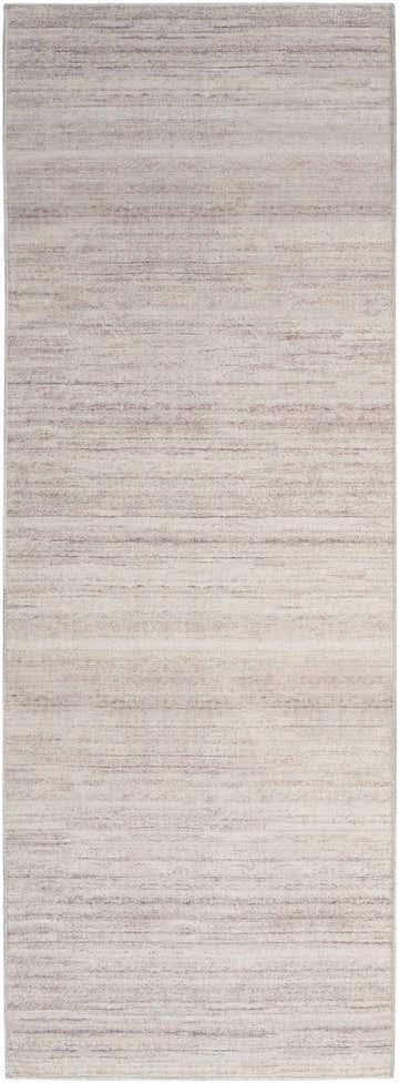 Close-up of the Nourison Essentials Ivory Mocha Rug. Modern design with subtle chestnut stripes. Washable area rug.