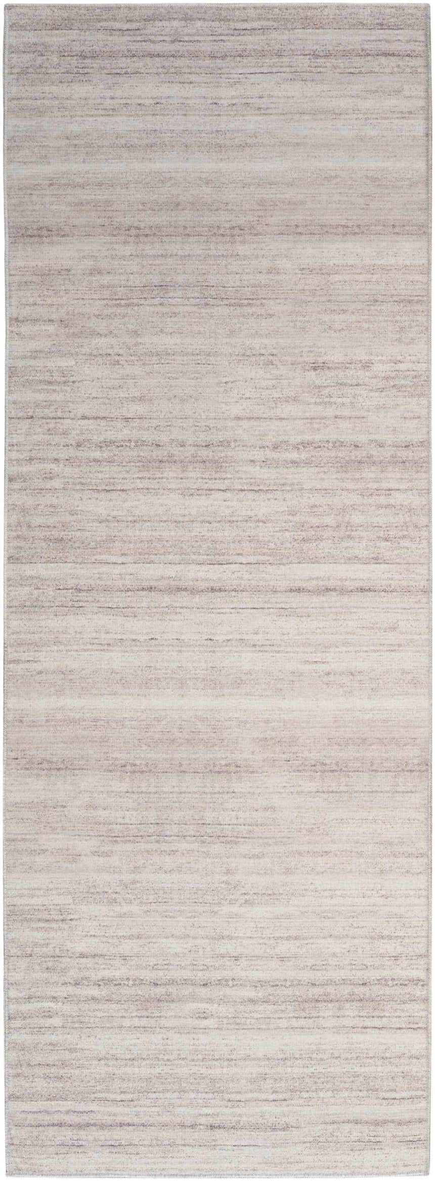 Close-up of the Nourison Essentials Ivory Mocha Rug. Modern design with subtle chestnut stripes. Washable area rug.