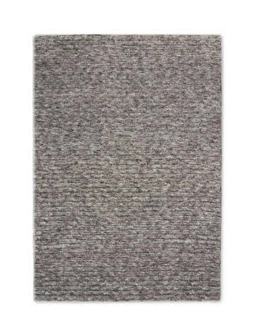 Close-up of the plush texture and gray color of the Calvin Klein Tulsa area rug. Handmade polyester rectangle.