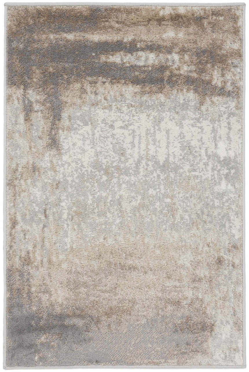 Close-up of Nourison Elation Grey Ivory rug. High pile, machine-made rug with chestnut, grey, and ivory abstract design.