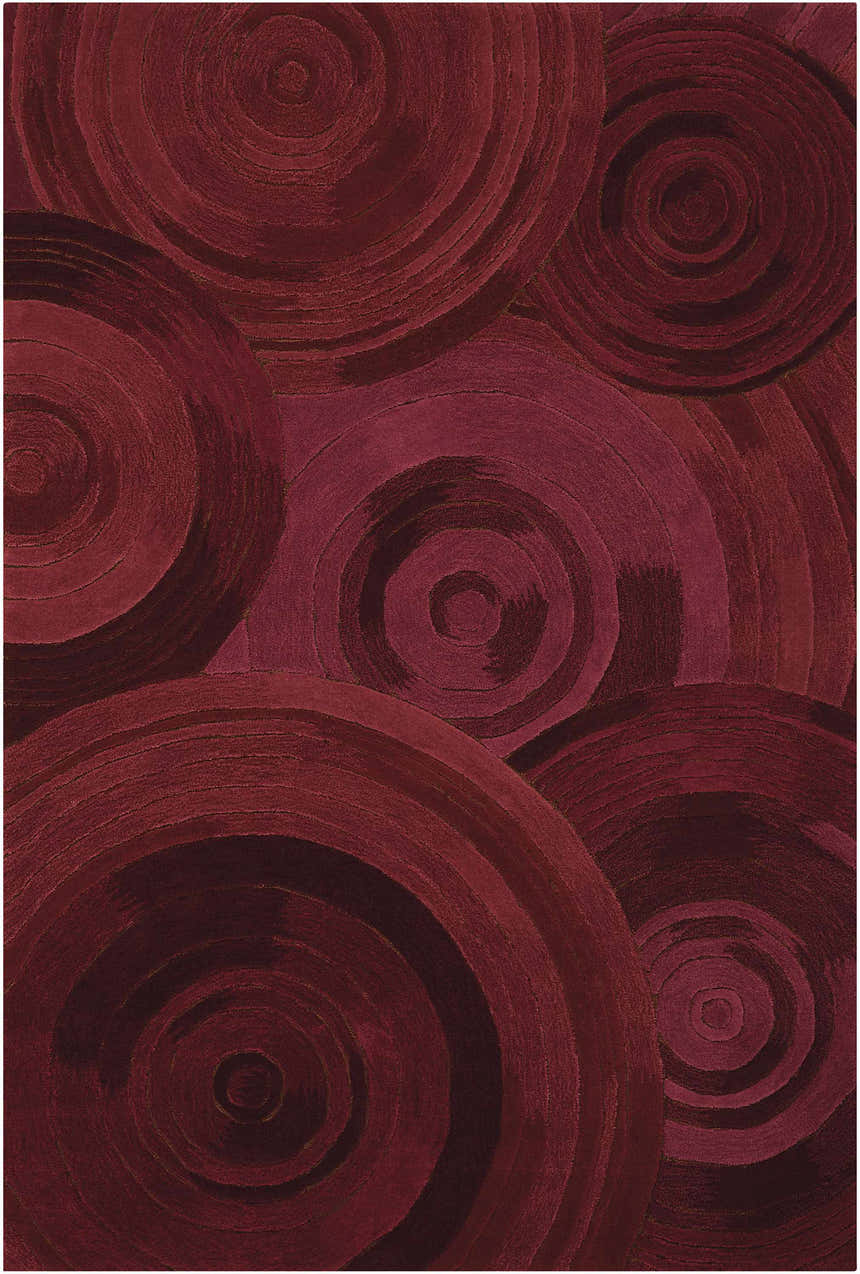 Close-up of the Nourison Palisades Plum area rug featuring a textured, dark purple concentric circle pattern.