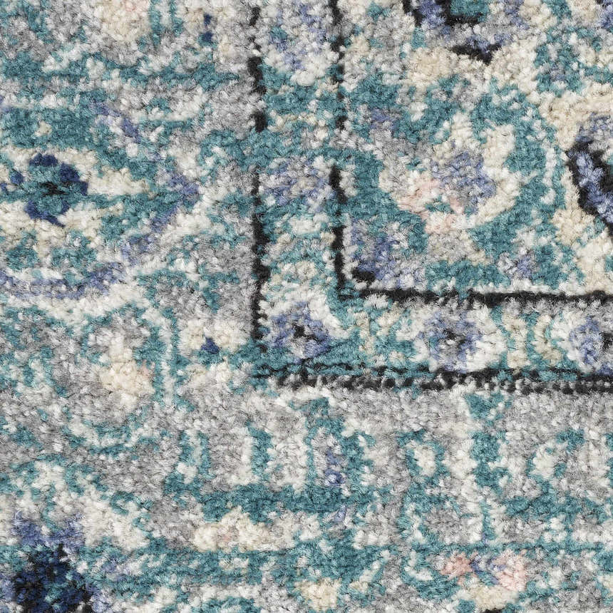 Close-up of Nourison Passion Turquoise Grey Bohemian Rug, showing texture and pattern.