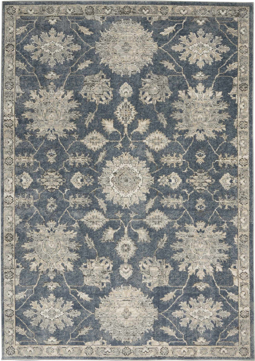Close-up of the Nourison Quarry Blue Beige Vintage Area Rug featuring a floral pattern and border.