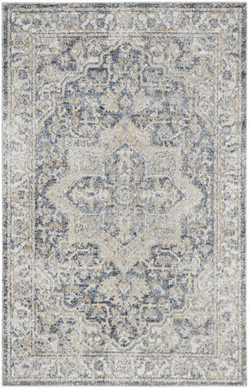 Close-up of a Nourison Astra Grey Blue Vintage Area Rug, featuring a detailed, distressed medallion pattern.