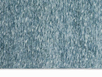 Close-up of the Calvin Klein Tulsa Aqua rug. Plush texture in blended shades of aqua and white.