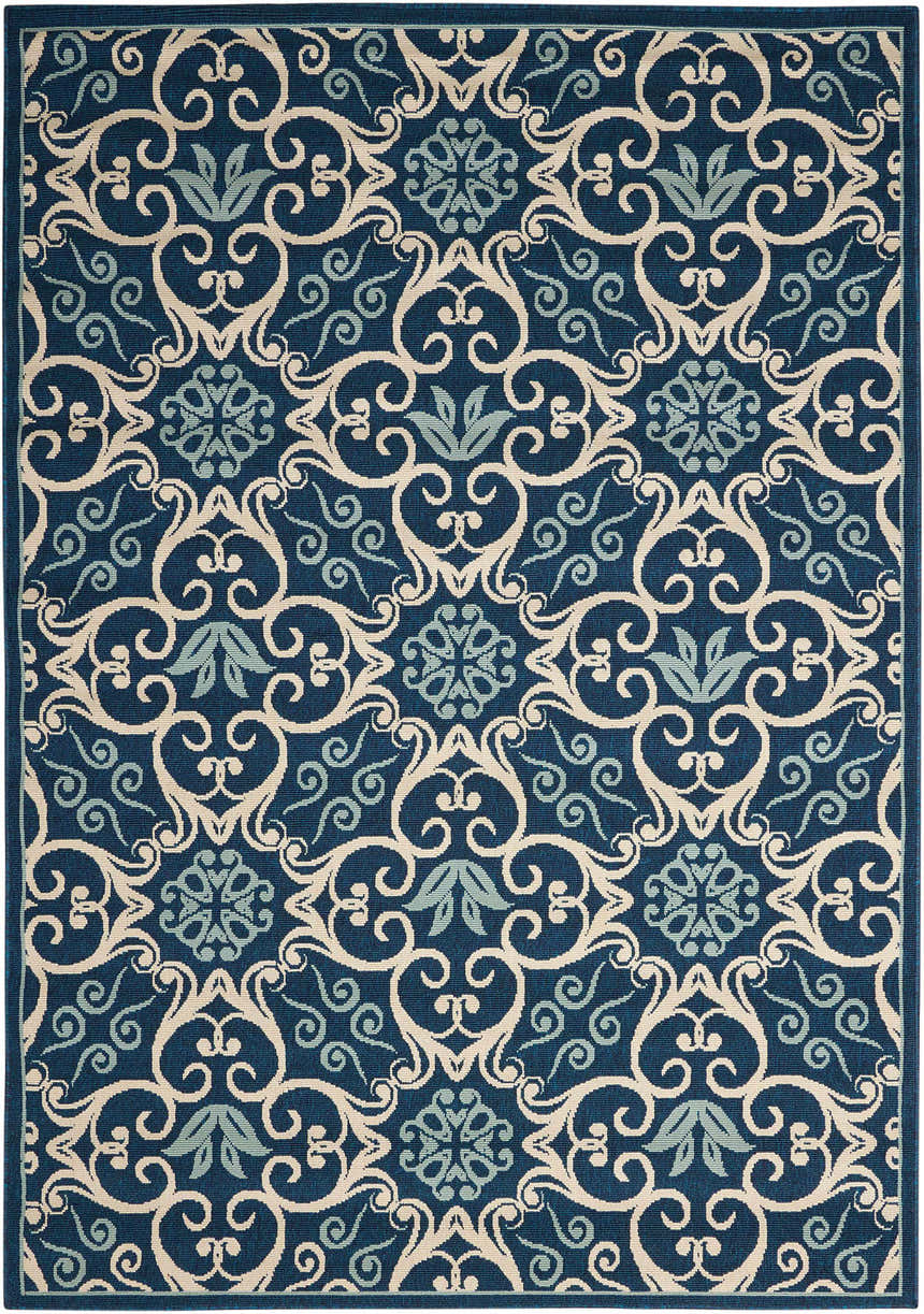 Close-up of the Nourison Caribbean Navy Contemporary Area Rug featuring a floral and scroll pattern in navy, beige, and light blue.