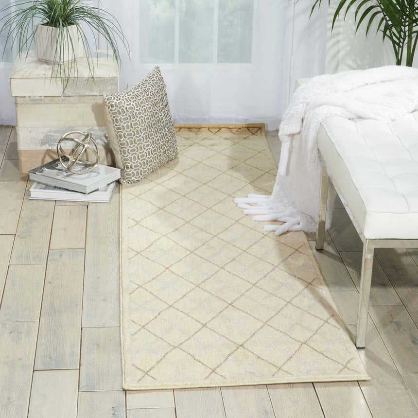 Bright entryway with Nourison Tranquility Ivory runner rug, white bench, and light wood floors.