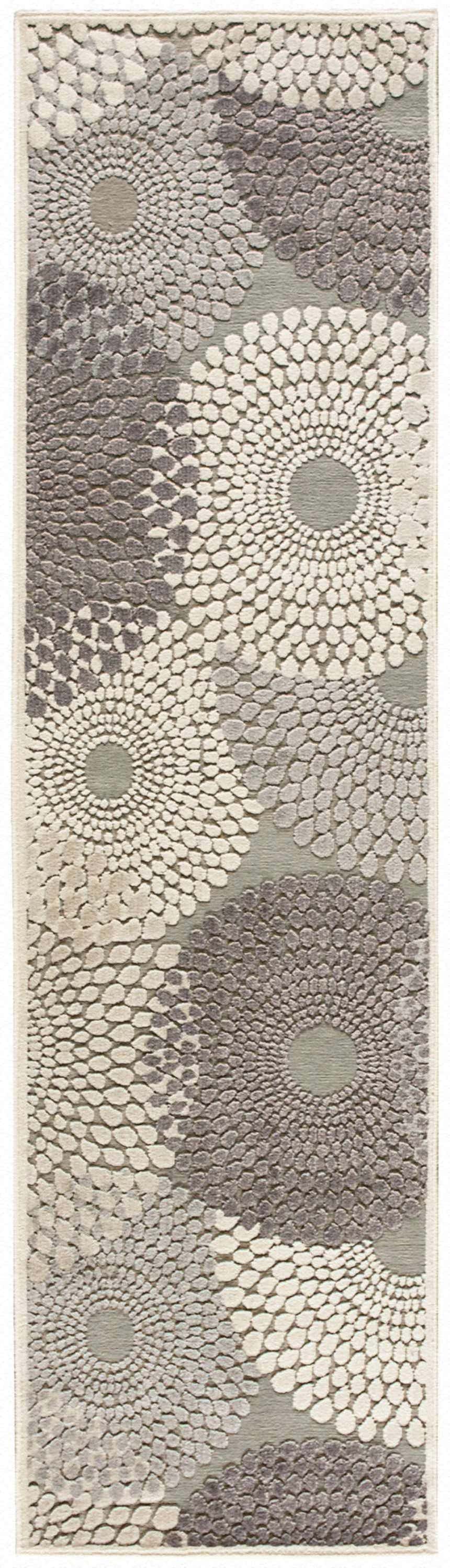 Close-up of the Nourison Graphic Illusions grey rug. Features a mid-century modern floral dot pattern in gray and ivory hues.
