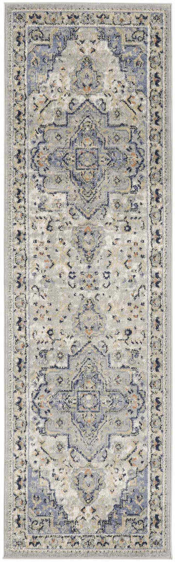 Close-up of the Nourison Essentials Persian Blue Vintage Area Rug featuring a traditional light blue and gray design.