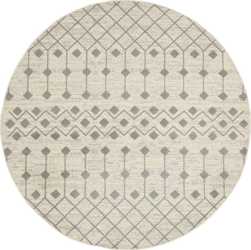 Close-up of round Nourison Grafix Ivory/Grey rug with a geometric diamond pattern and subtle texture.