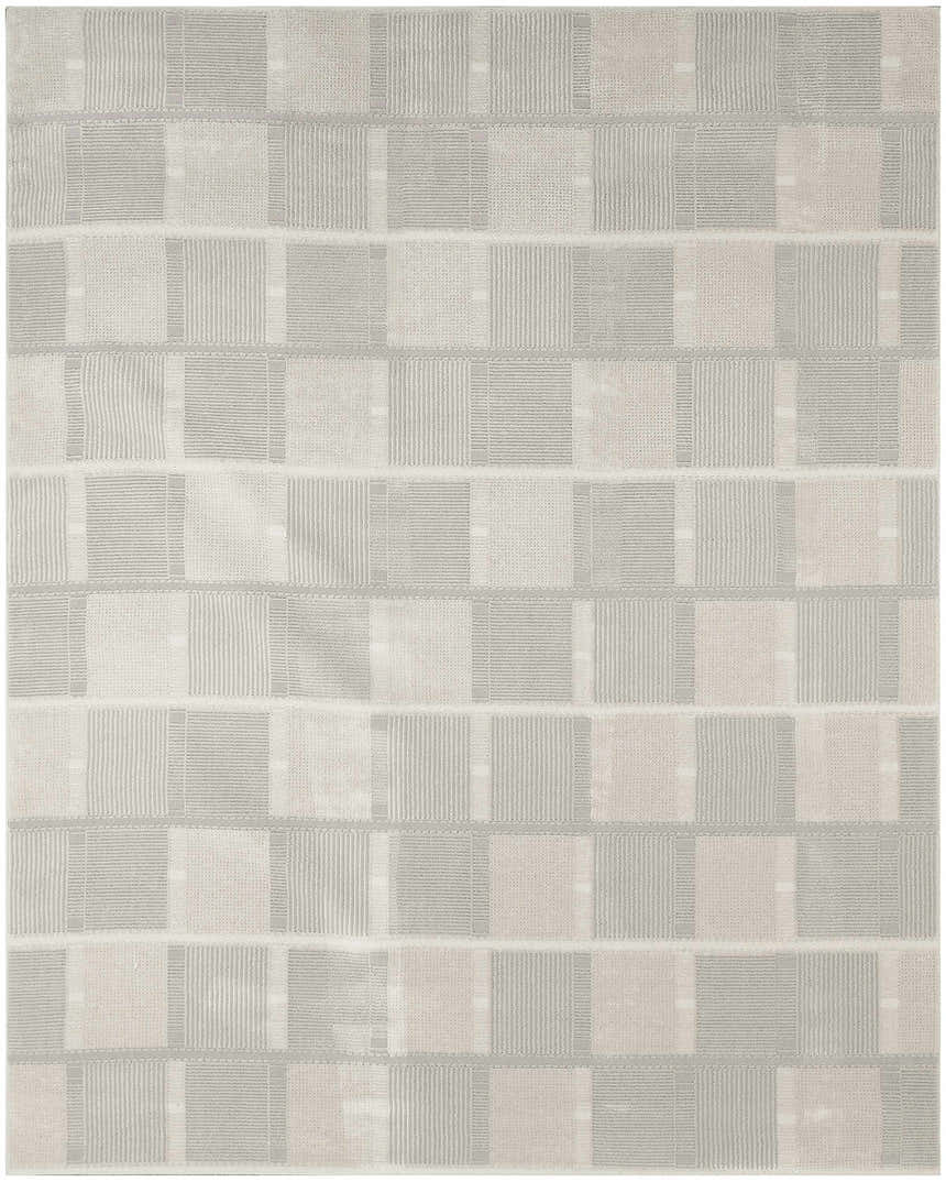 Close-up of Nourison Nordic Ivory Grey Rug. Modern design with chestnut accents and geometric pattern. Machine-made pile.