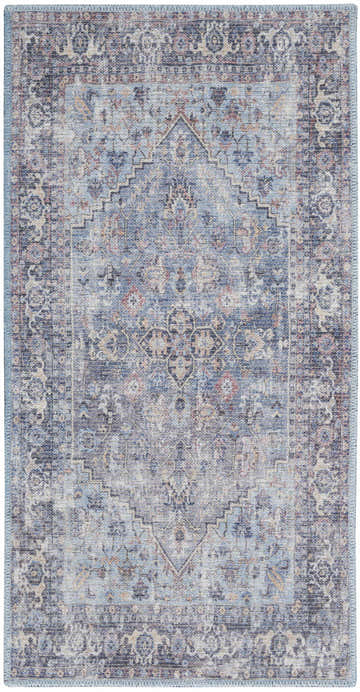 Close-up of Nourison New Concept Light Grey Blue Vintage Rug featuring a faded, ornate pattern and blue fringed edges.