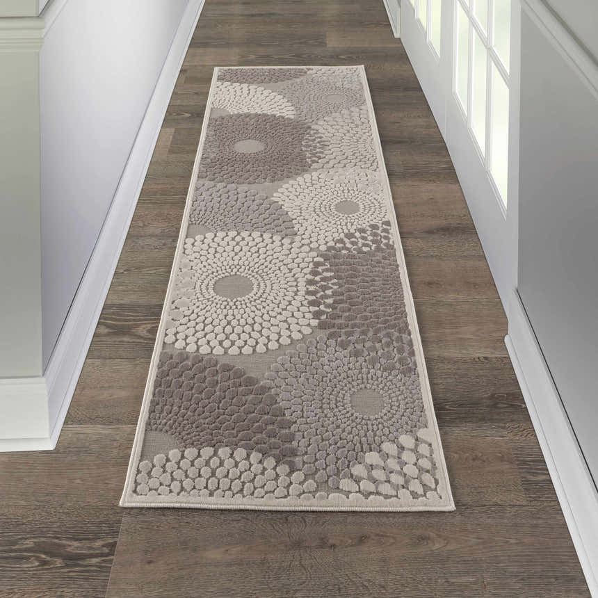 Hallway with Nourison Graphic Illusions grey runner rug featuring a mid-century modern floral design.