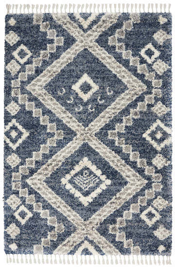 Close-up of Nourison Oslo Shag Denim Blue rug. Shag texture with diamond and geometric pattern in denim blue, gray, and white.