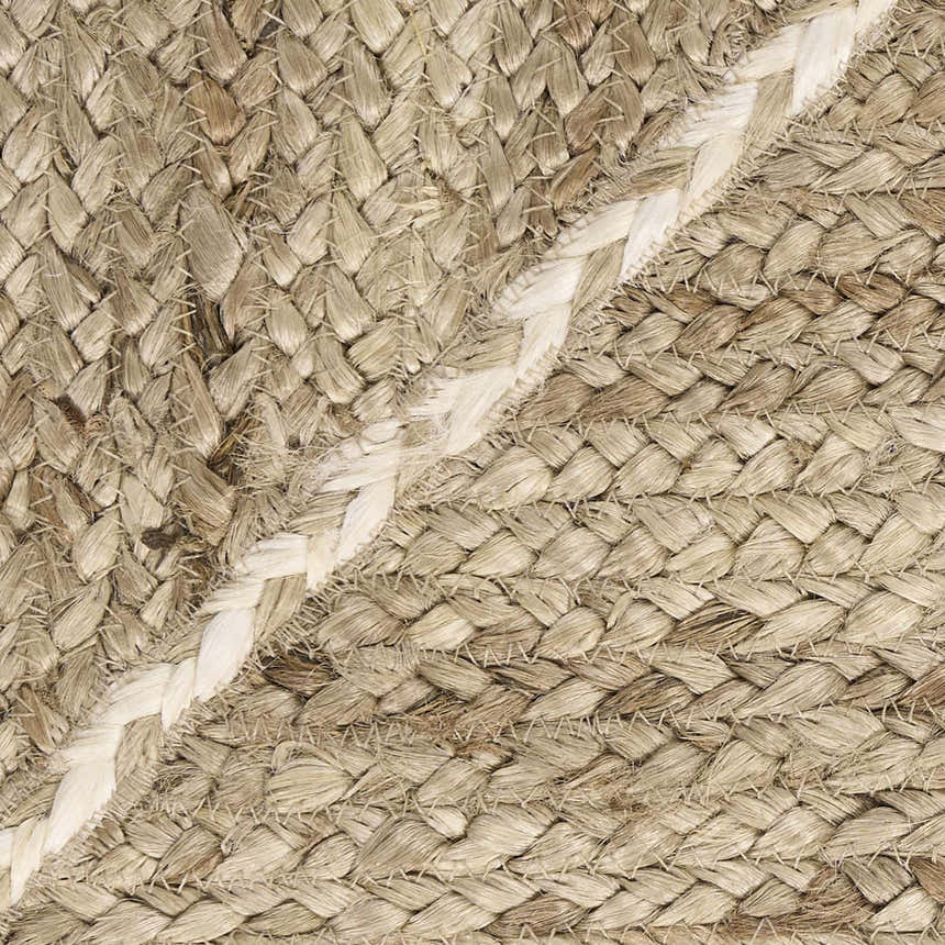 Close-up of the woven texture of the Nourison Terrazzo Jute Natural Grey rug with a light gray braided accent.