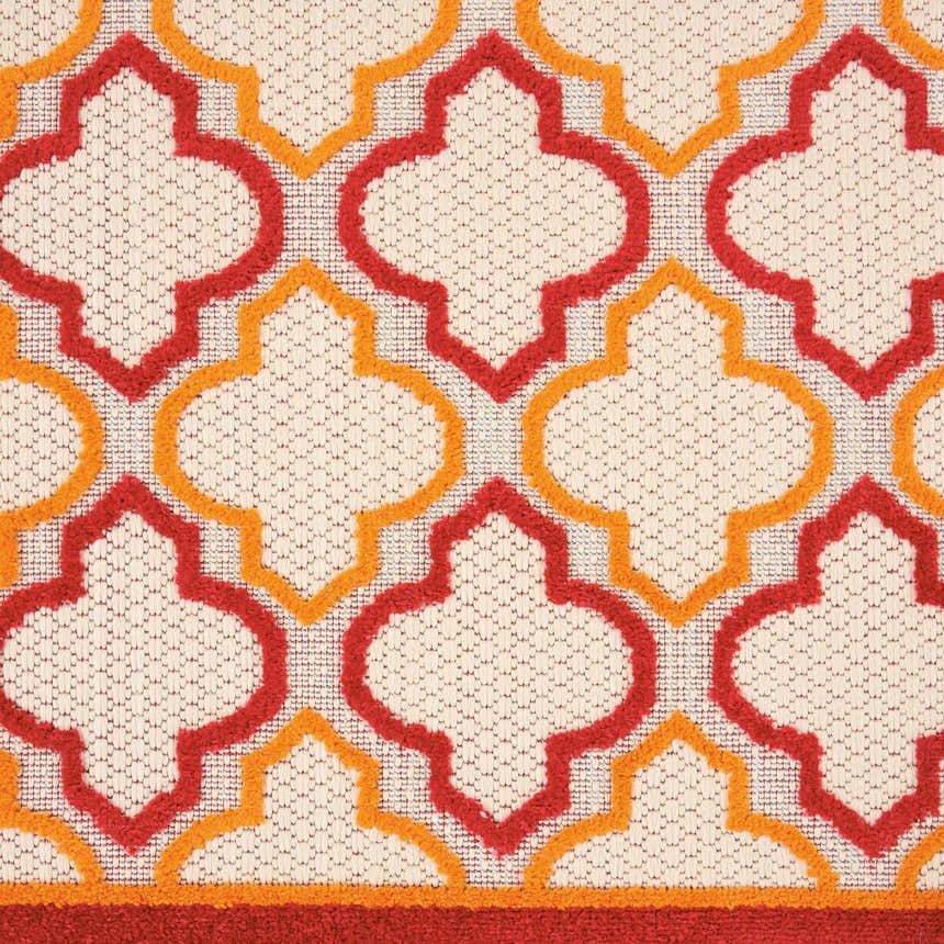 Close-up of Nourison Aloha Red Outdoor Area Rug pattern. Red and gold quatrefoil design on a textured cream background.