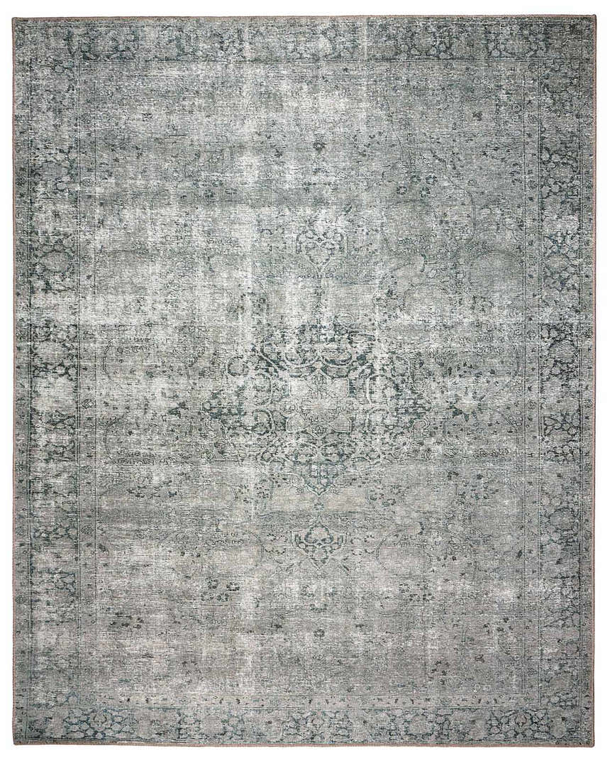 Close-up of the Four Hands Morelli Blue Area Rug featuring a traditional vintage design and distressed texture. Design-Rectangle