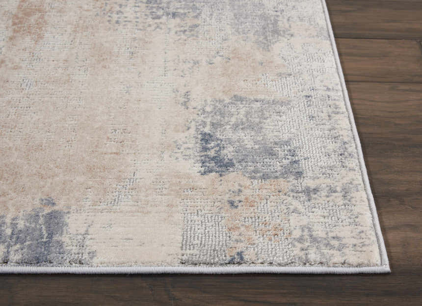 Close-up of the Nourison Rustic Textures Beige Grey rug showing its abstract pattern and soft texture.