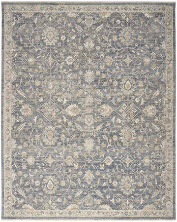 Close-up of the Nourison Retreat Blue Vintage Area Rug, featuring a floral pattern and light blue tones.
