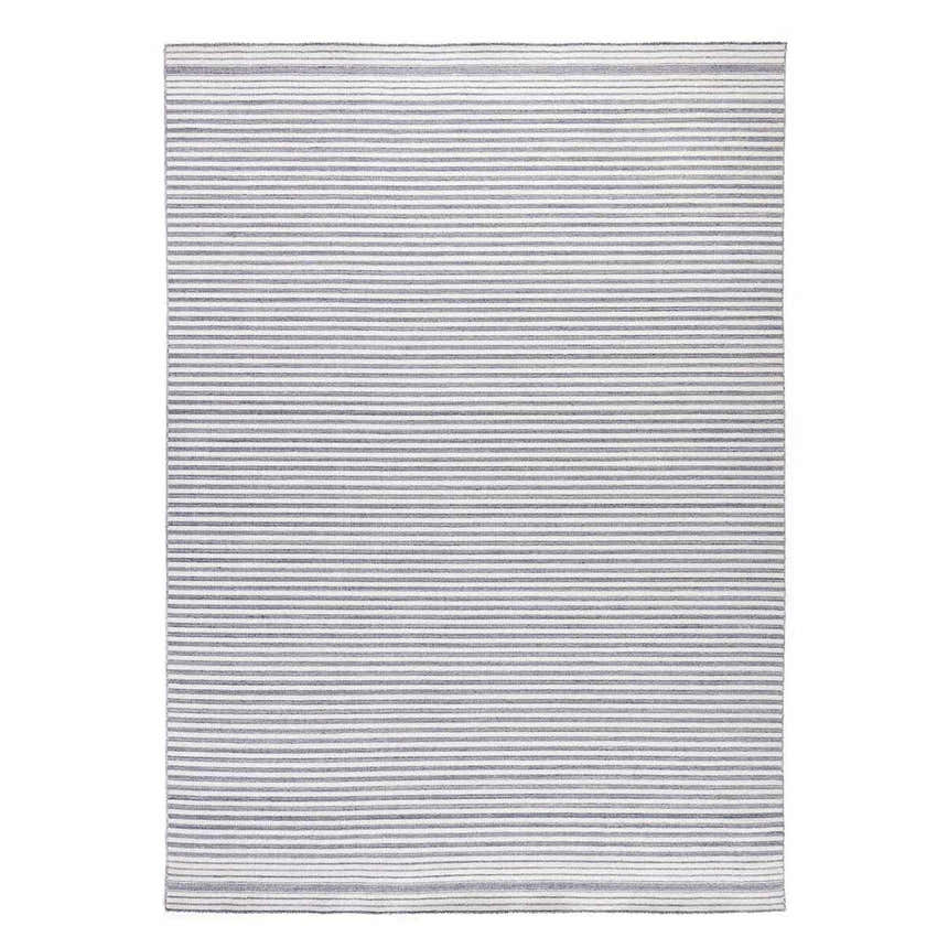 Close-up of the Four Hands Selena Outdoor Rug - Blue Stripe. Hand-woven PET rug with thin, horizontal blue and white stripes. Design-Rectangle