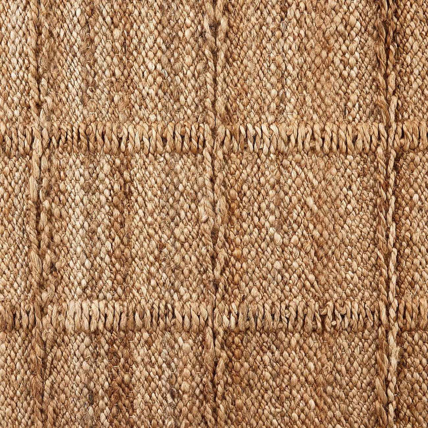 Close-up of the Four Hands Grid Jute Rug, showing the natural jute texture and grid pattern. Hand woven rug. Texture