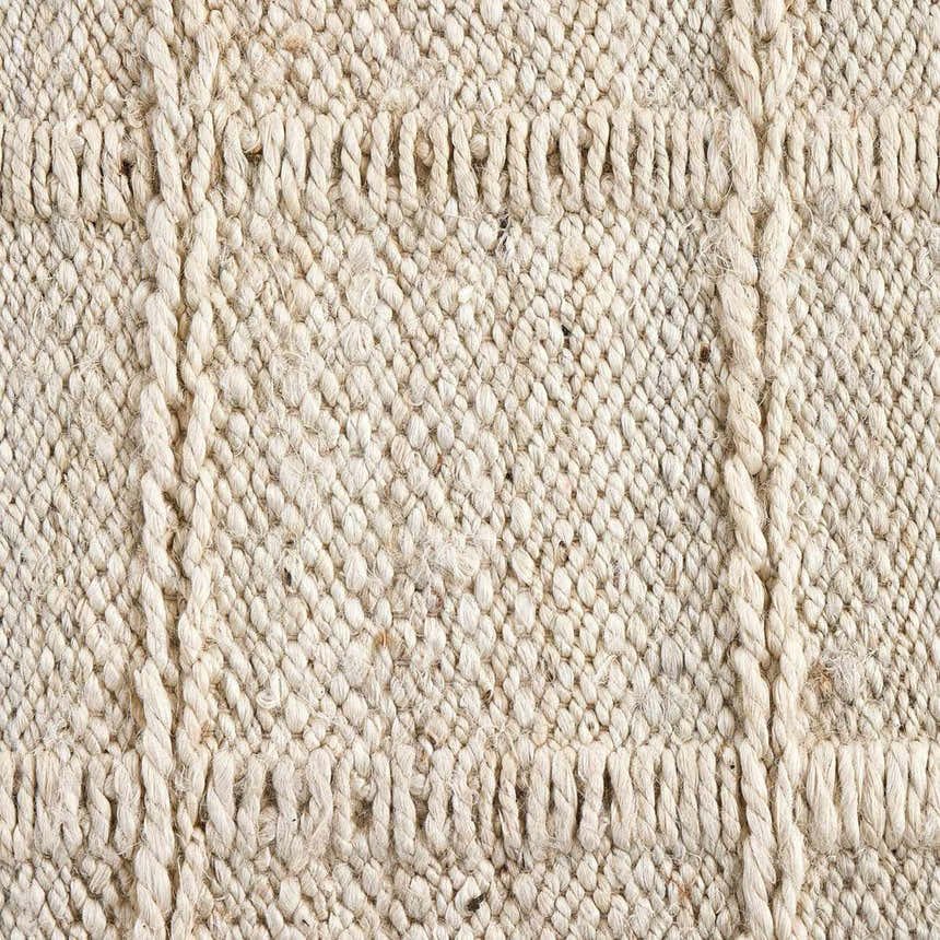 Close-up of the Four Hands Grid Jute Rug, bleached jute. Hand-woven texture with a subtle grid pattern. Texture