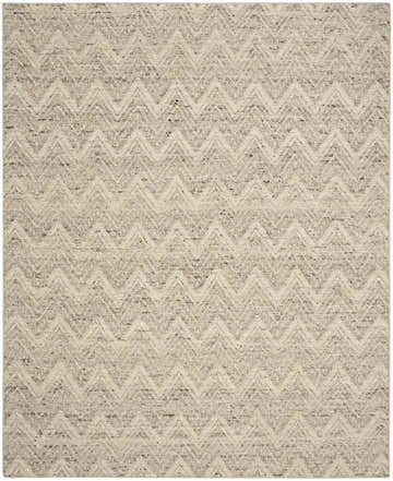 Close-up of the handmade DKNY Pure Purl rug. Grey and ivory wool with a modern chevron pattern. Textured weave.