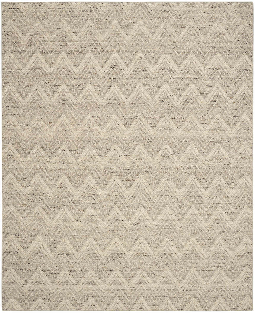 Close-up of the handmade DKNY Pure Purl rug. Grey and ivory wool with a modern chevron pattern. Textured weave.