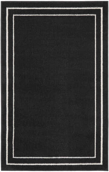 Close-up of the Nourison Essentials Black Ivory Contemporary Area Rug, featuring a black field and a double ivory border.