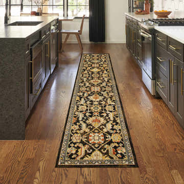 Kitchen scene with Nourison Antique Bloom Mocha Multicolor runner rug on hardwood floors.