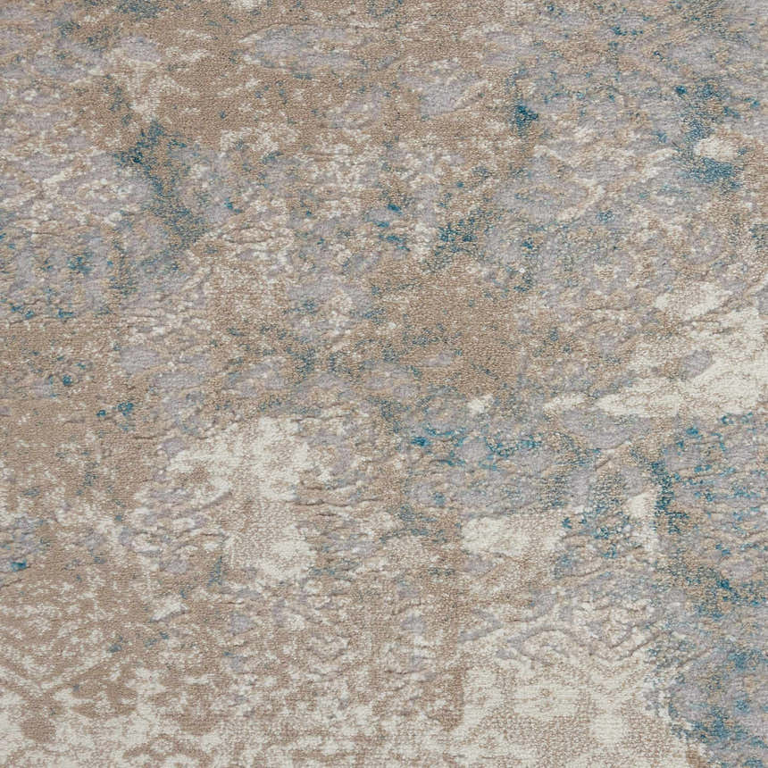 Close-up of the Nourison Karma Ivory/Light Blue Vintage rug showing texture and chestnut, ivory, and blue colors.
