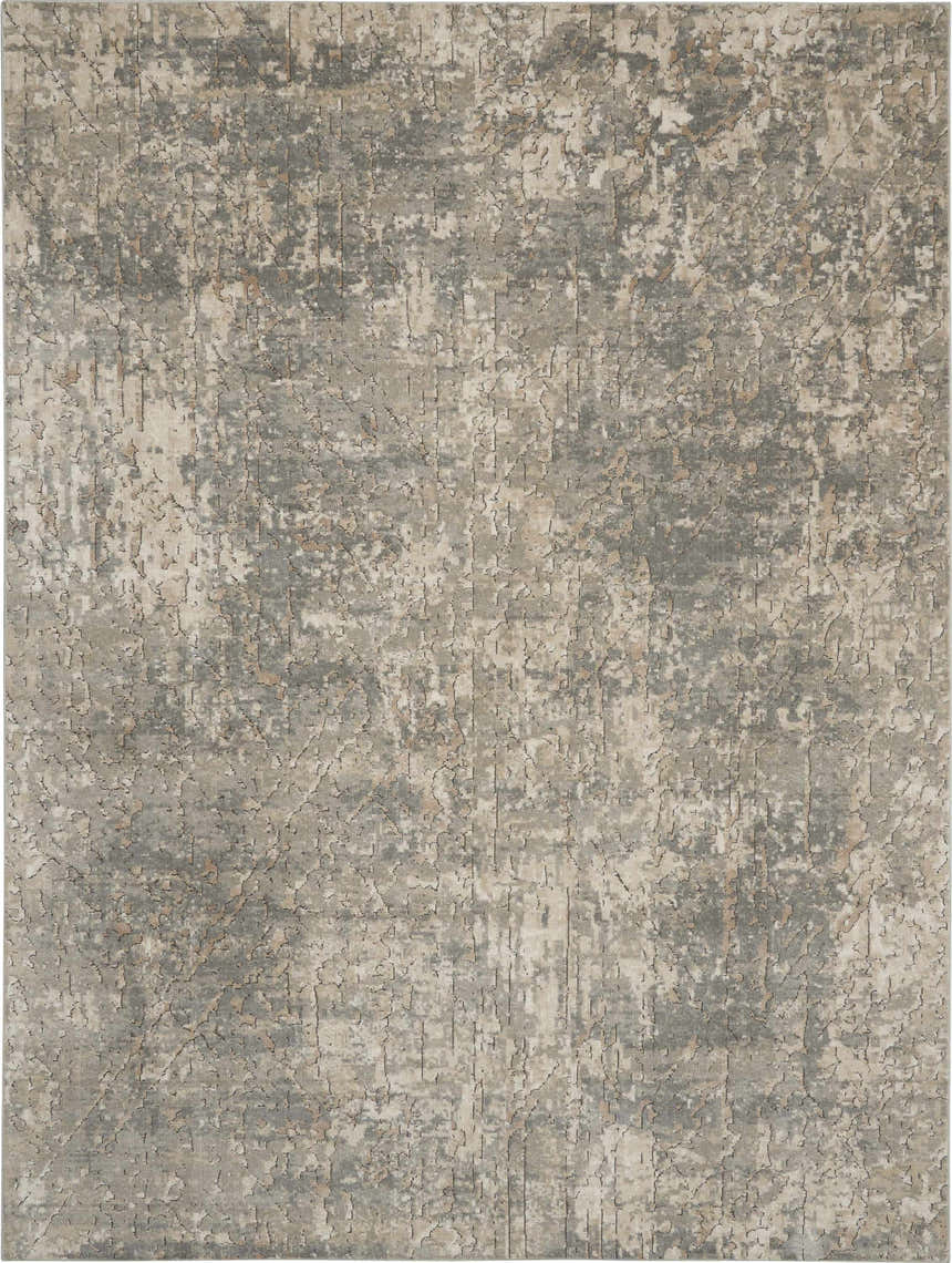 Close-up of Nourison Quarry Beige Gray rug. Abstract, distressed design with beige, gray, and subtle brown tones.