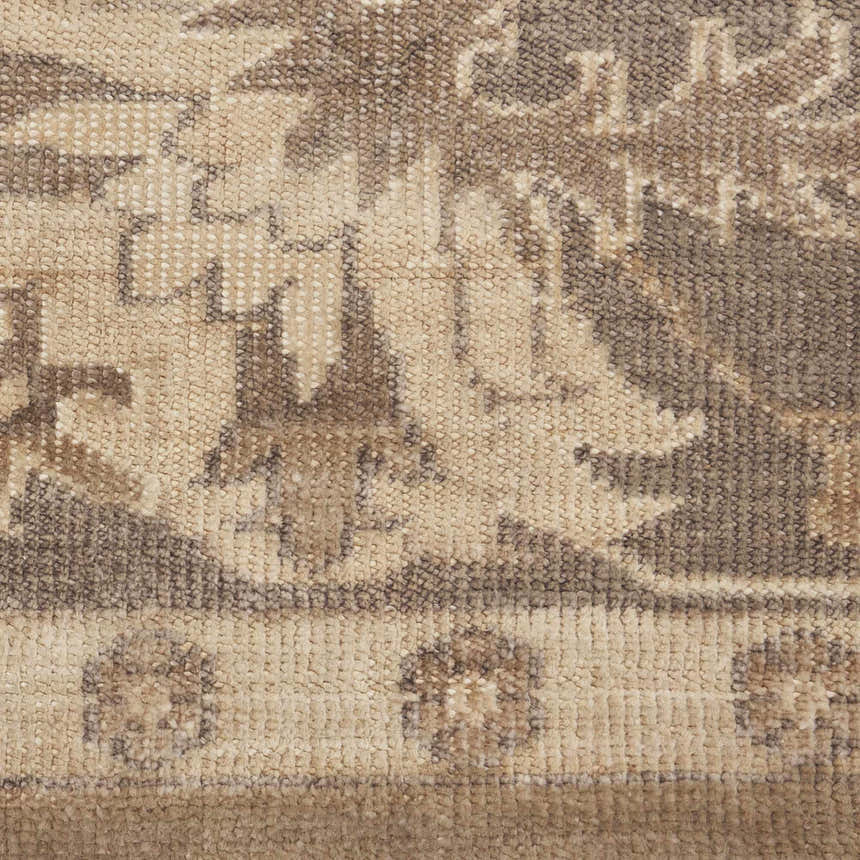 Close-up of the Nourison Aldora Opal Gray Rug. Shows vintage pattern, bamboo silk-like fiber texture, and neutral colors.