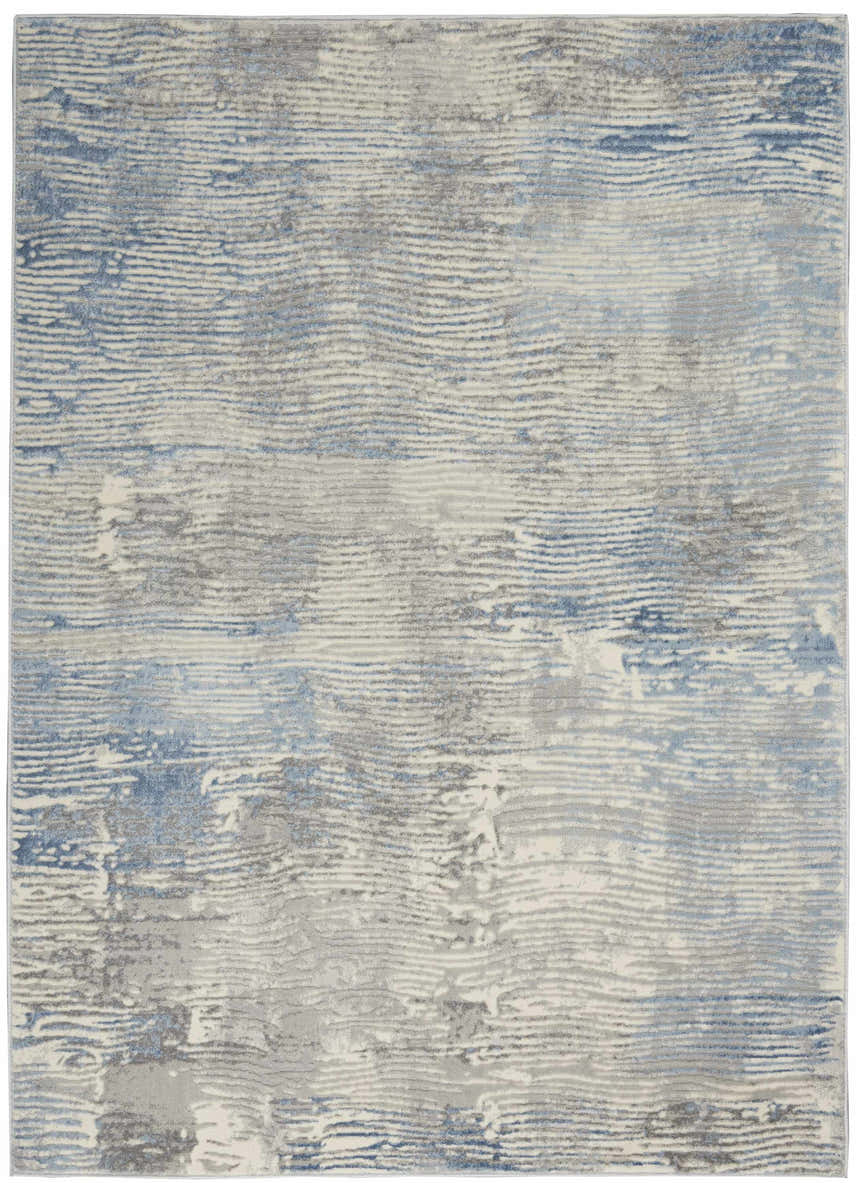 Close-up of Nourison Solace Ivory Grey Blue Rug. Abstract, striated design in ivory, grey, and blue hues. High pile texture.