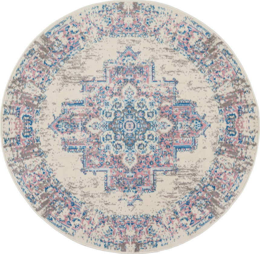Close-up of a round Nourison Grafix Ivory Pink Vintage Area Rug with a chestnut, blue, and pink distressed medallion pattern.