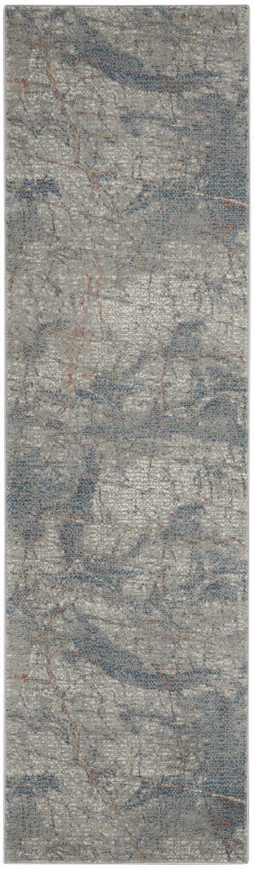 Close-up of Nourison Rustic Textures Light Grey Blue rug. Modern design with gray, blue, and rust colored accents.