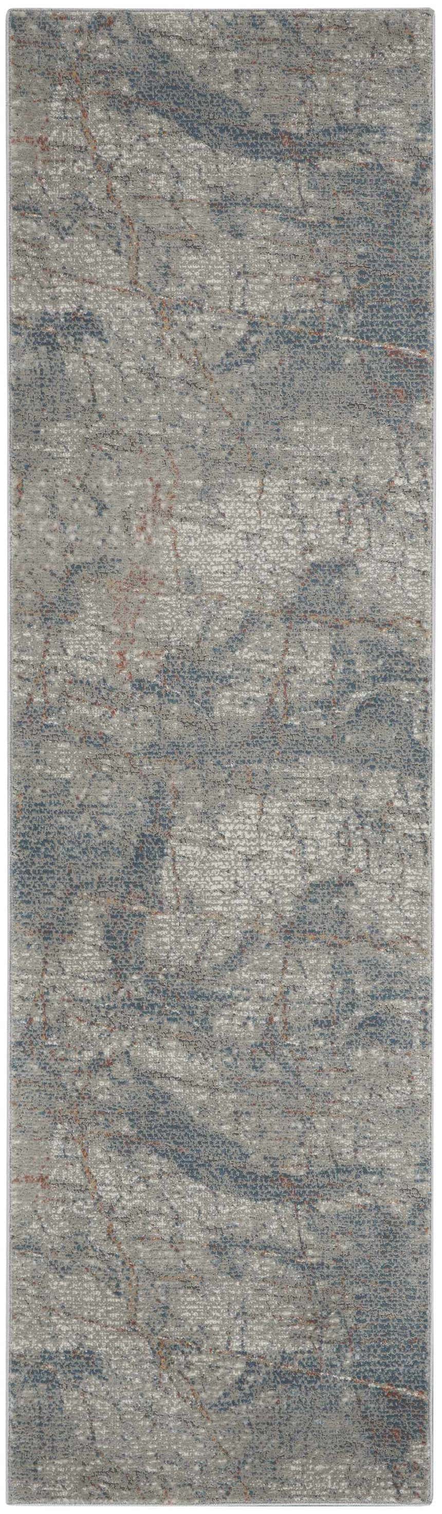 Close-up of Nourison Rustic Textures Light Grey Blue rug. Modern design with gray, blue, and rust colored accents.