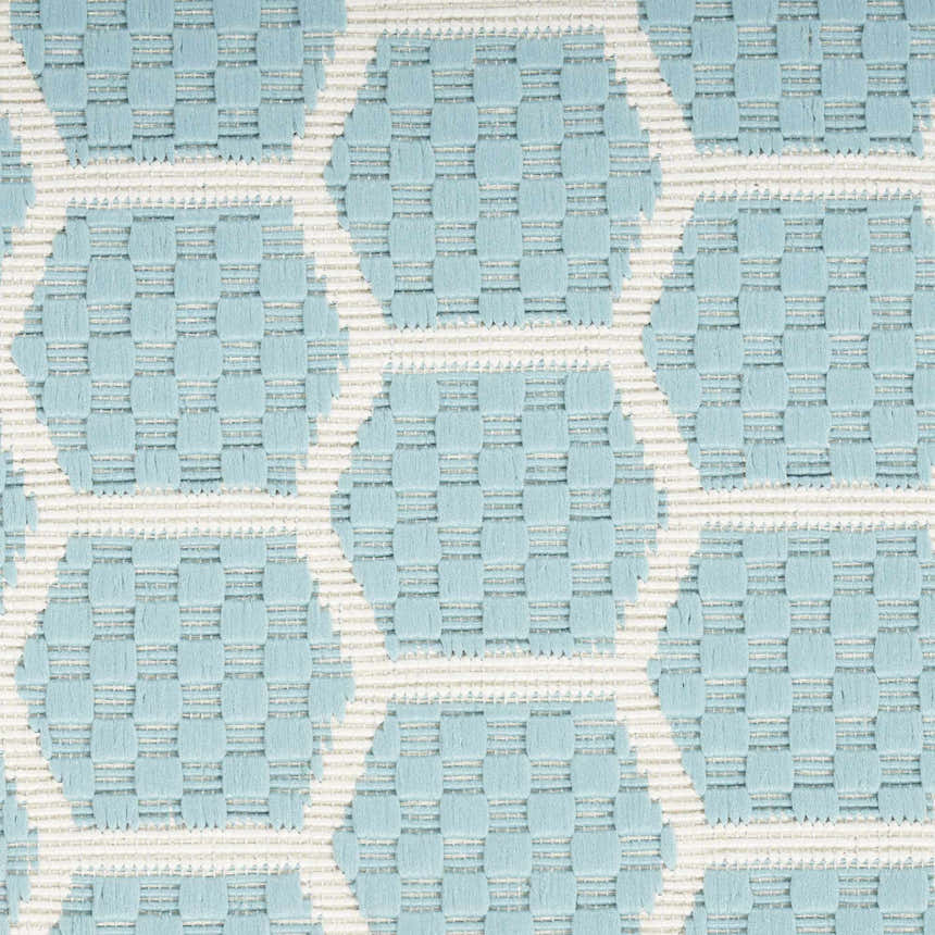 Close-up of the Nourison Twist Reversible Aqua Modern Area Rug, showing the geometric pattern and woven texture.