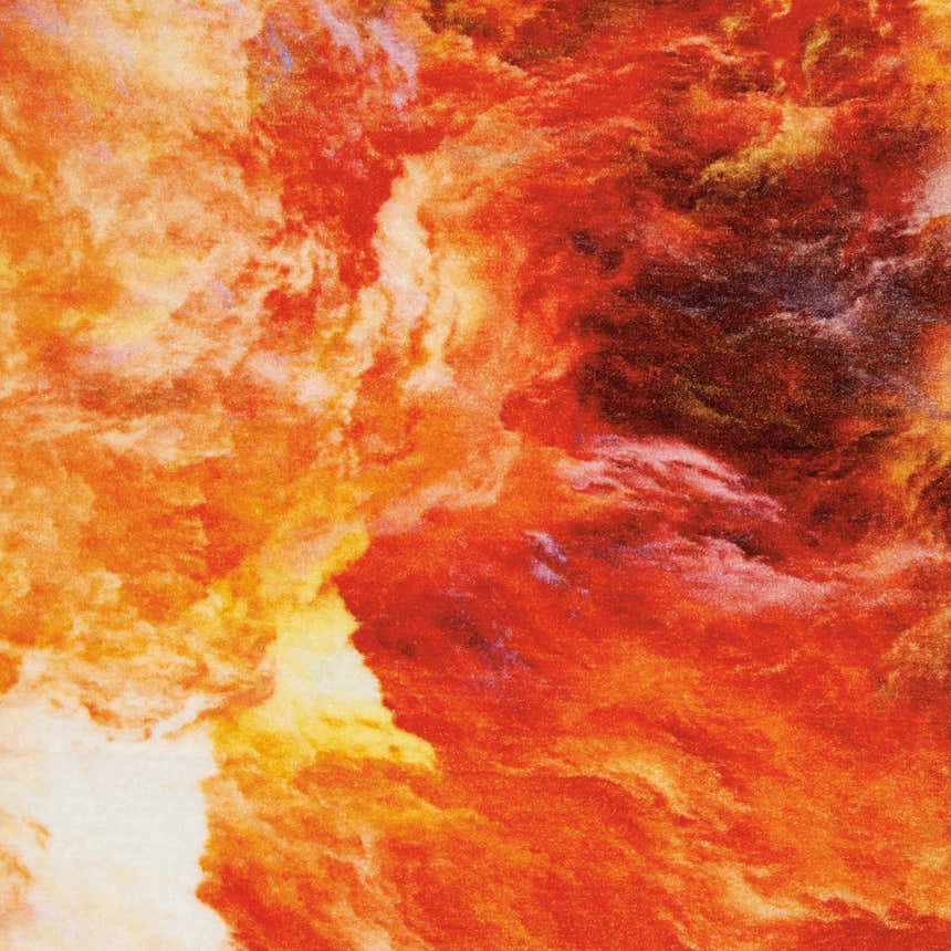 Close-up of the Nourison Le Reve Red Flame rug. Abstract design in shades of red, orange, yellow, and white.