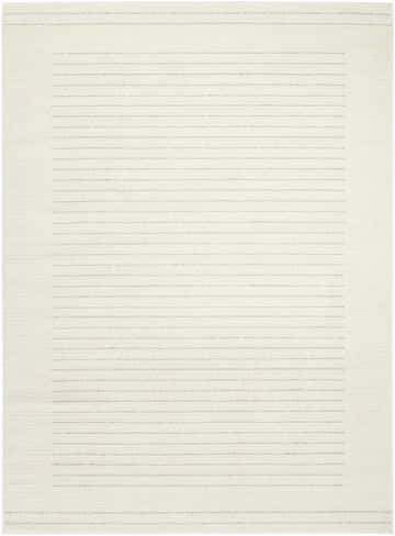 Close-up of the Nourison Ivory Hues rug, a modern design with ivory and grey horizontal stripes and a high pile texture.