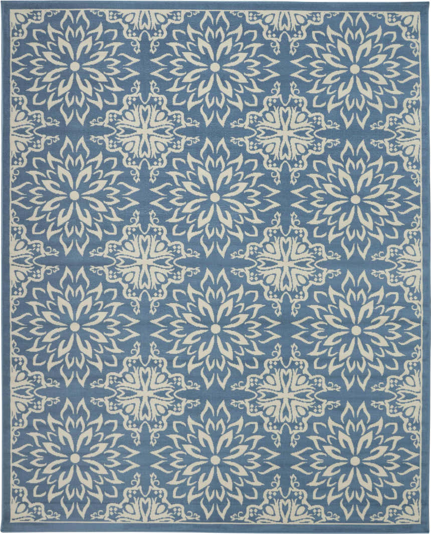 Close-up of Nourison Jubilant Ivory Blue rug featuring a floral medallion pattern on a blue background.