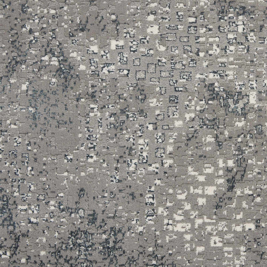 Close-up of the grey Michael Amini MA90 Uptown rug. Modern design with white and dark grey accents. Abstract pattern.