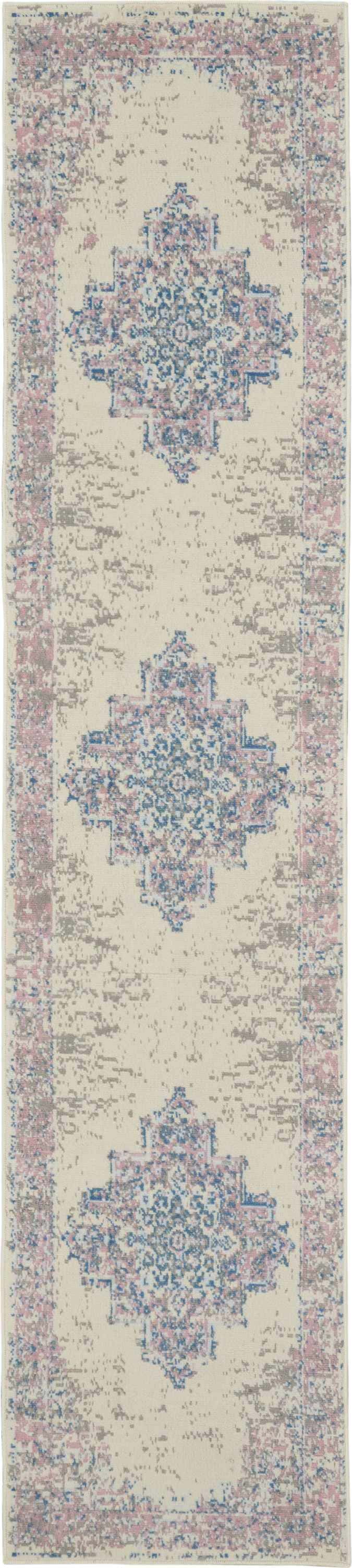Close-up of Nourison Grafix Ivory Pink Vintage Area Rug with chestnut, blue, and gray distressed geometric pattern.