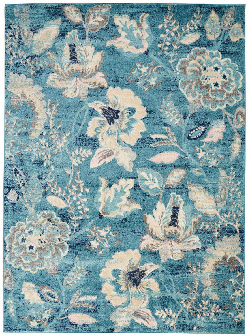 Close-up of Nourison Tranquil Turquoise rug. Vintage style with aqua, cream, and gray floral pattern. Machine-made polypropylene.